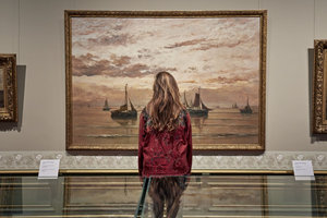 Woman looking at a painting in The Mesdag Collection