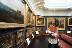 Woman looking at a painting in The Mesdag Collection