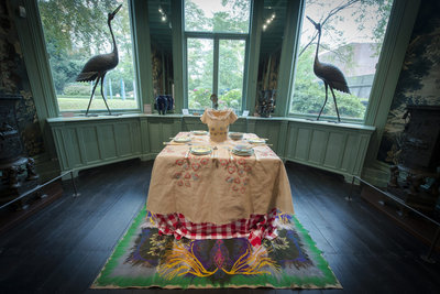 Laid tables in the Exhibition Chansons Grises